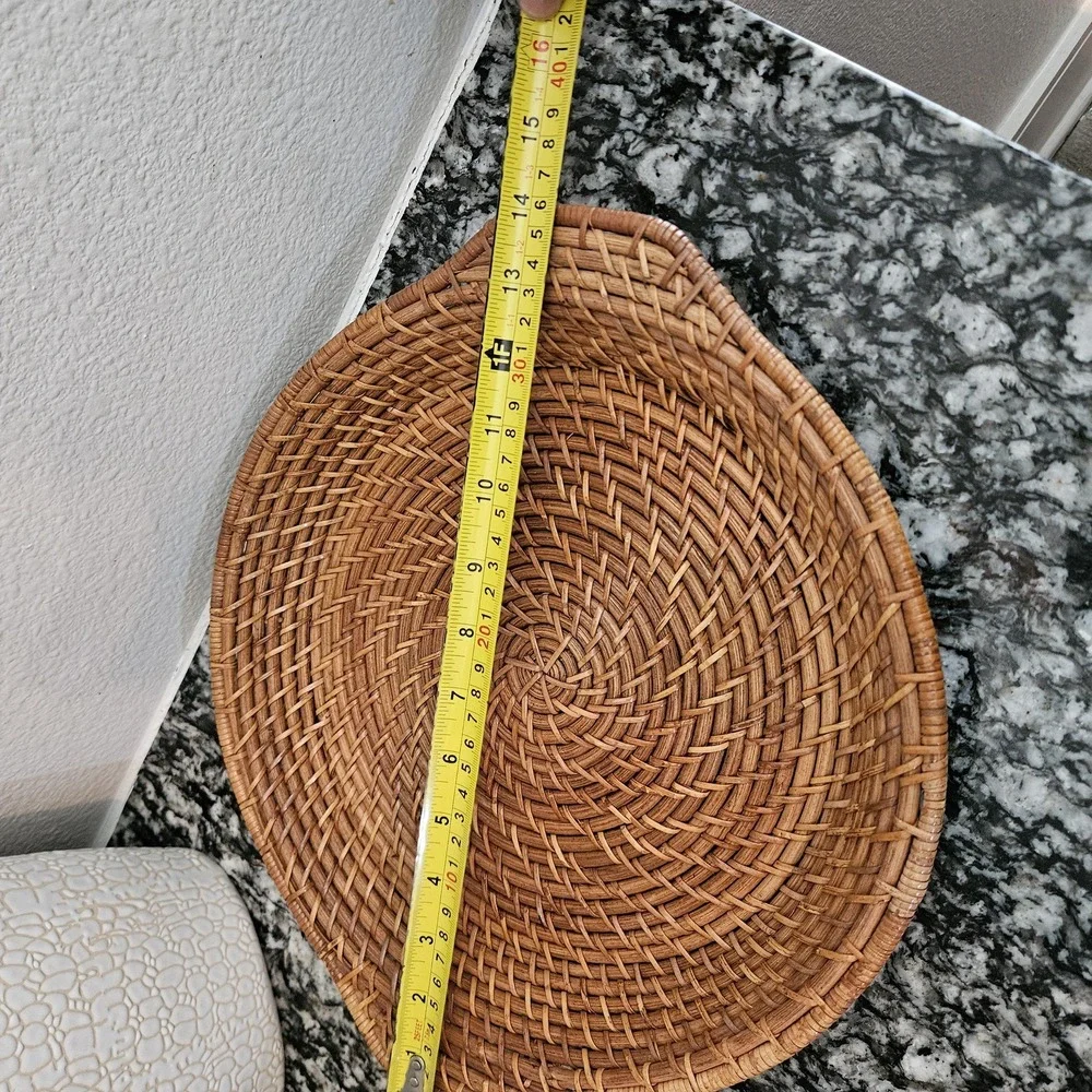 hand-woven rattan tray with a distinct spiral patterns serving plate